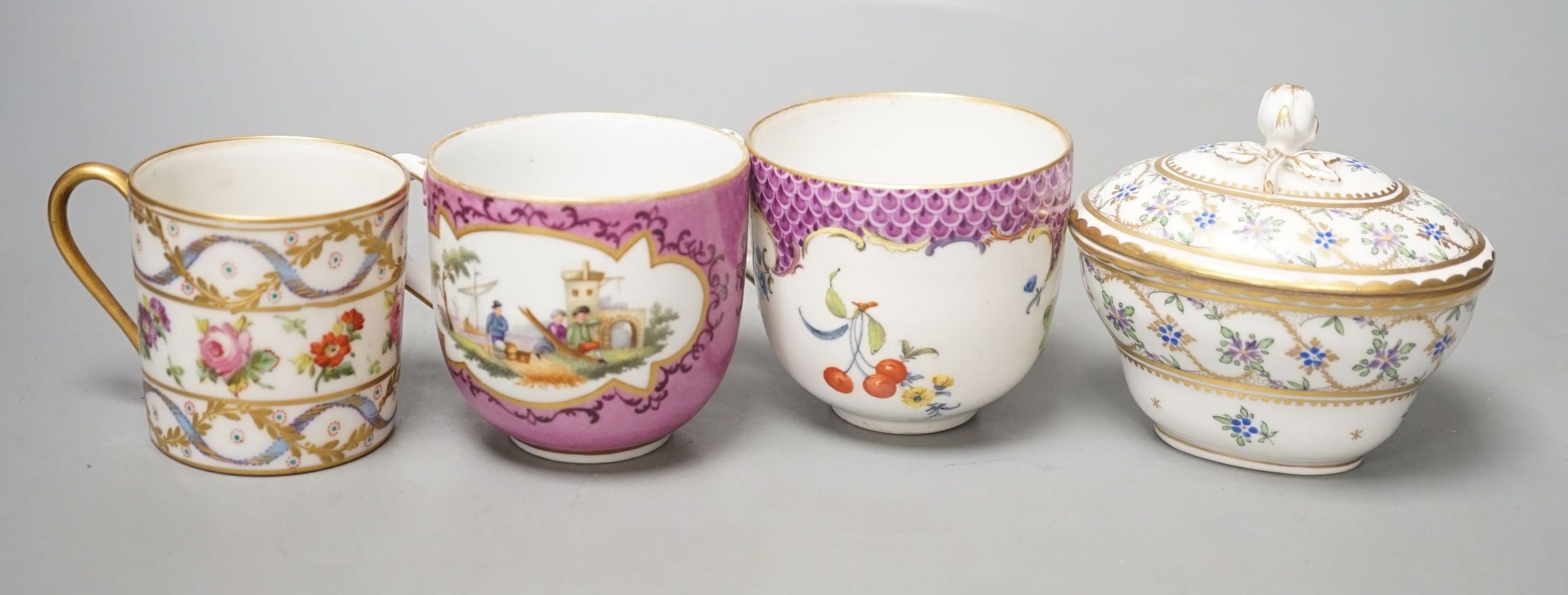 An 18th century Meissen pink ground coffee cup with entwined handle painted on two sides with a figural landscape on a pink ground, a 19th century French box and cover painted with flowers, a German coffee cup with pink